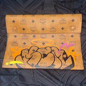 MCM Brown Clutch with Vibrant Graphic Accents